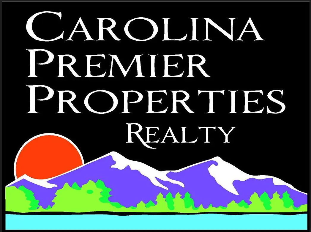 A black and white logo of the carolina premier properties realty.